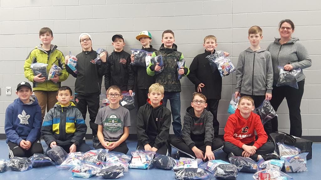 Pee Wee Tier 4 with Care Packages for the less fortunate this holiday season. Way to go boys!